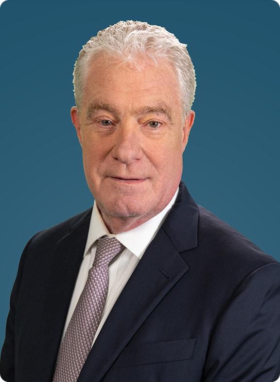 Joe Poirot headshot with navy blue background