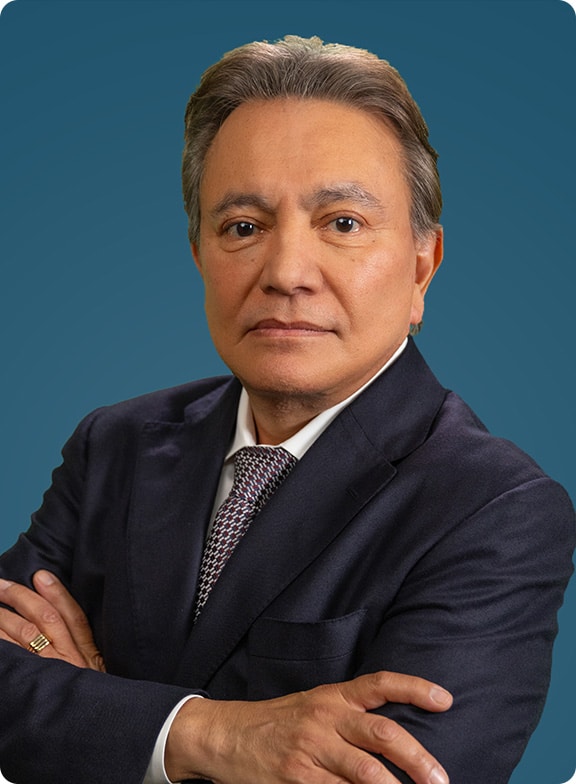 Jesse Ferrer headshot with navy blue background