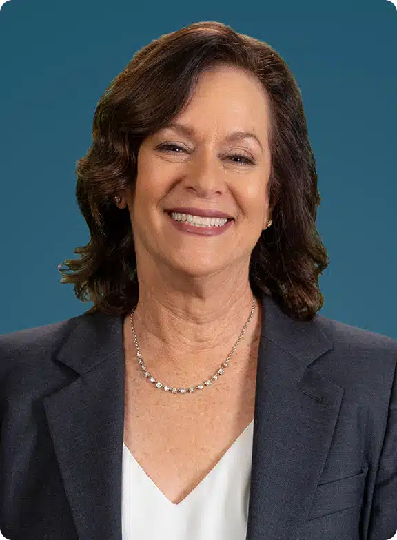 Ellen Presby headshot with navy blue background