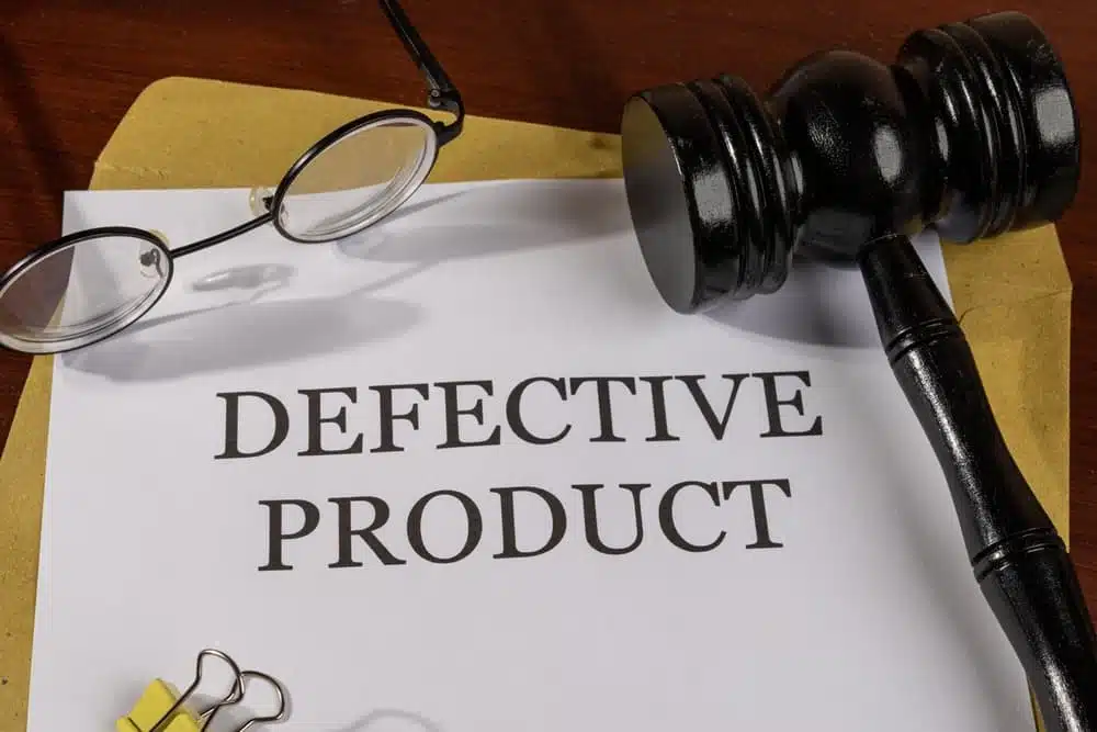 Defective Product Title on Legal Documents Set on Desk